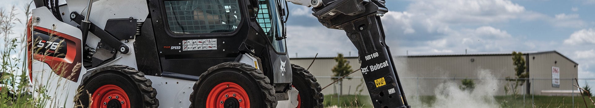 Bobcat skid steer with jackhammer attachment
